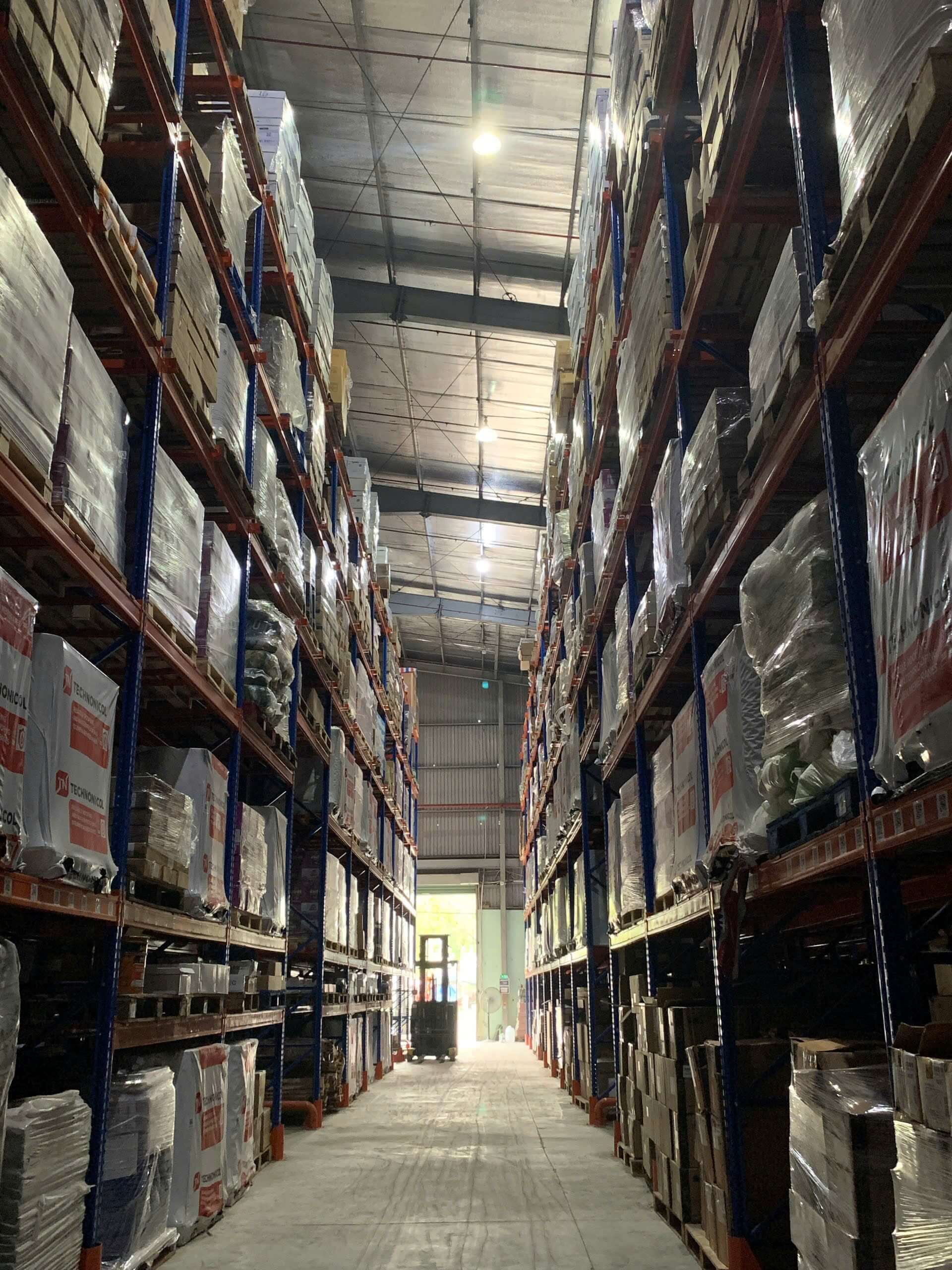 Inside a large warehouse with neatly organized goods
