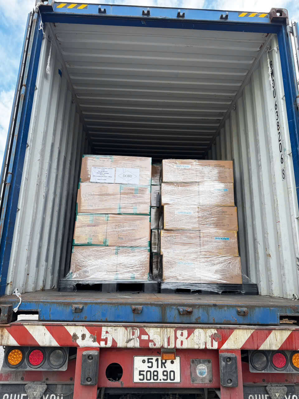 Trucks transporting goods in a logistics warehouse